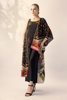 Nida (B) – Sania Maskatiya International Black Georgette Dress With Cape Sleeves, Black Silk Sets With Floral Print, Summer Georgette Sets With Cape Sleeves, Summer Sets With Sheer Dupatta And Cape Sleeves, Summer Sets In Georgette With Cape Sleeves, Summer Sets With Cape Sleeves In Georgette, Elegant Summer Cape Set, Bohemian Black Sets With Printed Motifs, Black Silk Kaftan With Kimono Sleeves