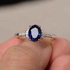 This is a gorgeous handmade creation. Its beauty is its simplicity & Elegance. The 6*8mm oval cut lab sapphire is crafted in solid sterling silver and with rhodium plated. It's made to order and it will take about 7 days to make it. All item is sent in a beautiful gift box You can realize more lovely stuff clicking the link https://www.etsy.com/shop/knightjewelry?refshopsection_shophome_leftnav Please leave the correct address and you phone number for delivering successfully. Oval Sapphire Promise Ring, Oval Cubic Zirconia Sapphire Ring Gift, Oval Lab-created Sapphire Ring, Oval Solitaire Sapphire Ring With Cubic Zirconia, Oval Sapphire Ring In Sterling Silver, Silver Oval Sapphire Ring, Oval Lab-created Sapphire Birthstone Ring, Oval Sapphire Ring In White Gold For Gift, Oval Sapphire Ring As Gift