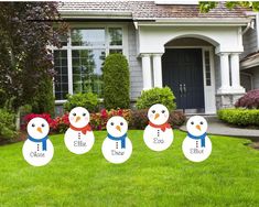 snowman yard decorations in front of a house