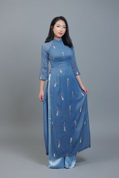 Custom Ao Dai featuring unique, embroidered, sheer fabric over blue, chiffon lining. After ordering we will send you a quick and simple form to guide you through taking the measurements we require for an amazing fit. Shipping details: Please allow 3-4 weeks for custom making and shipping, once measurements are received. Colors: Please note; we make every effort to ensure our photos accurately represent the true colors of each garment, but due to the nature of different devices, screen brightness, lighting conditions etc. small variations can sometimes occur. Fitted Blue Ao Dai For Summer, Summer Fitted Blue Ao Dai, Festive Fitted Blue Ao Dai, Blue Summer Dresses With Sheer Dupatta, Simplest Form, Sheer Fabric, Sheer Fabrics, True Colors, Vietnam