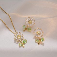 Description:Daisy Flower Necklace Earrings Set Specifications: Size: Necklace 40 cm + 5 cm ext/Earrings 2.5 cm *1.5 cmMaterial: copper, cubic zirconia, gold, silverColors: Gold/SilverHypoallergenic: Yes Get ready to bloom with this fresh and playful Daisy Flower Necklace Earrings Set! Adorned with delicate daisies, this set adds a touch of whimsy to any outfit. Perfect for those who embrace their fun-loving side! (And what's better than a matching set?🌼) Daisy Jewellery, Daisy Pendant, Daisy Jewelry, Daisy Design, Daisy Necklace, Flower Lights, Flower Pendant Necklace, Jewellery Set, Stunning Necklace