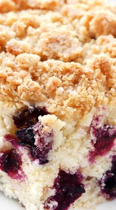 a piece of blueberry crumb cake on a white plate