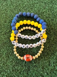 Celebrate football season in style with this Michigan Wolverines, blue and yellow bracelet stack. Perfect for Game Day!  This listing is for a stack of 3 Bracelets. All items are made to order and ship within 5 days.  Note: All beads are handmade and may vary in color and size from the listing picture. Spacer bead may vary depending on availability and not guaranteed to tarnish. Blue Team Spirit Beaded Bracelets As Gift, Personalized Blue Bracelets For Game Day, Personalized Blue Bracelets For Sports Events, Blue Beaded Bracelets For Team Spirit Gift, Blue Team Spirit Jewelry For Game Day, Casual Blue Jewelry For Game Day, Sporty Blue Bracelets For Sports Events, Game Day Jewelry, Team Bracelets