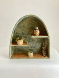 a shelf with pots and other items on it