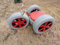 two plastic wheels with red spokes on the ground