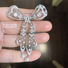 Thank you for coming in! Beautiful rare Belle Epoque era antique diamond platinum brooch! The design and craftsmanship are exquisite and delicate! The arms have movable joints. Weight: 20.67 grams Size: 2.6 inch x 2.1 inch Precious Metal: Platinum Precious stones: -Diamond: 4.2 carats total Vintage White Gold Brooches With Brilliant Cut, Art Deco Diamond Hallmarked Brooches, Art Deco White Gold Brooch In Platinum, Art Deco Platinum Brooches In White Gold, Art Deco White Gold Platinum Brooches, Vintage Brooches With Brilliant Cut Diamonds, Formal Rose Cut Diamond Brooch, Vintage Platinum Brooches With Diamond Accents, Art Deco White Gold Diamond Brooch