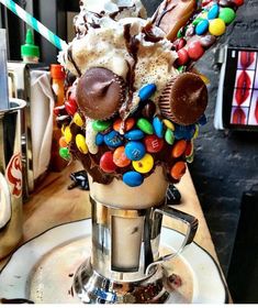 an ice cream sundae topped with candy and candies