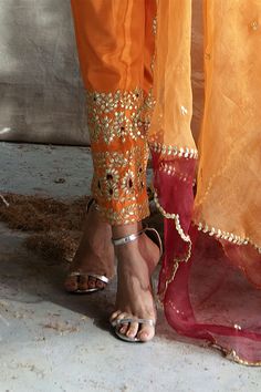 Orange short kurta with all-over embroidered motifs and round neck. Paired cigar pants and dupatta.
Component: 3
Embroidered
Neckline: Leaf
Sleeve Length: Full
Fabric: Silk, Organza
Color: Orange
French knots, beads and gota embroidery
Flared short kurta
Drawstring at the waist with latkans
Embroidered dupatta - Aza Fashions Short Kurta Set, Leaf Sleeve, Cape Jumpsuit, Short Kurta, Kurta Set For Women, French Knots, Jumpsuit Skirt, Orange Shorts, Embroidered Neckline