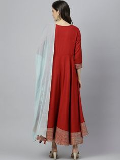 Size & Fit Sizes: To Fit Bust (in inches): S(34), M(36), L(38), XL(40), 2XL(42), 3XL(44) Length: 50 inches PRODUCT DETAILS Consists of a kurta and dupatta Kurta Color: maroon Dupatta color: Blue Solid Round neck Three-quarter, regular sleeves Anarkali shape with angrakha style Ankle length with flared hem Material & Care Viscose Rayon Hand-wash Complete The Look You'll love the elegant design and fit of this stunning dress from Vitans. Dress up for your next family event by pairing this piece wi Maroon Dupatta, Kurti With Dupatta, Kurta And Dupatta, Angrakha Style, Anarkali Kurti, Family Event, Viscose Rayon, Anarkali Dress, Blue Solid