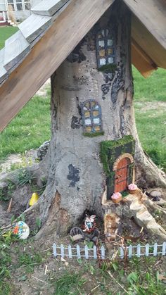 a fairy house built into the side of a tree