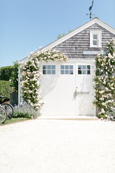 the instagram page for instagram com features an image of a house with flowers on it