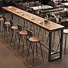 the bar is set up with four stools for six people to sit at it