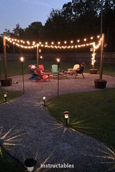 an outdoor area with lights and lawn chairs