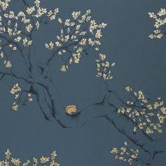 a tree with white leaves on it against a dark blue wallpapered background that has gold leaf designs