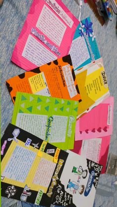 several pieces of colorful paper with writing on them