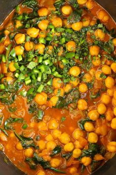 a pot filled with lots of food on top of a stove