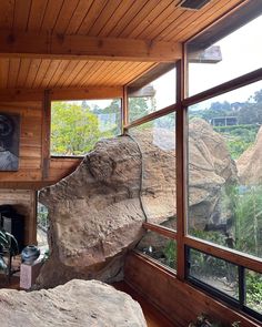 a large rock sitting in the middle of a living room