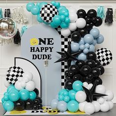 a tombstone surrounded by black and white balloons