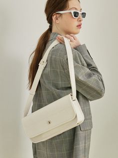 Editor's NotesELNOI's bag is classic and perfect for everyday wear.- Basic design- Sophisticated material- Inner card slot- Daily bag- Vintage moodMeasurements(in.)- Size: 11.81 in. (W) / 5.51 in. (L) / 2.36 in. (D)- Strap: 34.25 ~ 40.15 in.Composition & Care- Vegan leather- Avoid direct heat and moisture- Professional cleaning is recommendedDesigner- by ELNOI Classic Beige Baguette Bag For Everyday Use, Classic Beige Baguette Bag For Daily Use, Classic Beige Baguette Bag, Classic Beige Baguette Bag For Travel, Classic Workwear Bags With Flat Pocket, Everyday Baguette Satchel Bag With Magnetic Closure, Classic Travel Baguette Bag With Magnetic Closure, Beige Everyday Bag With Magnetic Closure, Classic Baguette Bag With Magnetic Closure For Travel