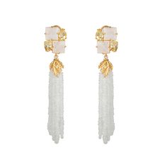 The Carole Earrings are a testament to vintage and art deco style, featuring exquisite rainbow moonstone and lemon quartz. The removable hand strung tassels offer a fresh and versatile look, while the studs alone exude a timeless elegance. These earrings are perfect for those who appreciate the fusion of classic and contemporary design, ideal for various occasions. Elegant Yellow Gold Earrings With Tassels, White Gemstone Earrings For Evening, Elegant Yellow Gold Jewelry With Tassels, Luxury Evening Jewelry With Tassels, Luxury White Earrings With Gemstone Accents, Elegant White Earrings With Gemstone Accents, Luxury Dangle Tassel Jewelry, Luxury White Briolette Earrings, Luxury Formal Tassel Jewelry