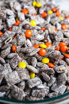 a glass bowl filled with candy corn dog treats