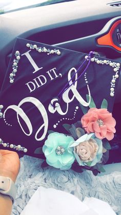 a black graduation cap with flowers and beads on it that says, i didn't dad