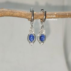 BAND- ROUNAK JEWELLERS MATERIAL- 925 STERLING SILVER GEMSTONE - LAB BLUE STAR SAPPHIRE, CUBIC ZIRCONIA BLUE STAR SAPPHIRE STONE WEIGHT - 2.30 CT SAPPHIRE STONE SIZE - 5 X 7 MM CUBIC ZIRCONIA STONE SIZE - 1.30/ 2.50 MM CUBIC ZIRCONIA STONE WEIGHT - 0.25 CT EARRINGS WEIGHT - 4.070 GM STONE SHAPE - OVAL, ROUND GEM COLOUR - BLUE, WHITE PLEASE GIVE YOUR OPENION OR FEEDBACK ABOUT THE PRODUCT. WE ACCEPT BULK ORDER ALSO. https://www.etsy.com/in-en/shop/RounakJewellers?ref=search_shop_redirect Handmade Sterling Silver Cluster Earrings For Anniversary, Silver Sapphire Earrings With Gemstones, Fine Jewelry Sterling Silver Hoop Earrings With Gemstone, Sterling Silver Hoop Earrings With Gemstones, Sterling Silver Sapphire Gemstone Earrings, Silver Sapphire Drop Earrings, Sterling Silver Sapphire Diamond Earrings, Sapphire Sterling Silver Diamond Earrings, Sapphire Sterling Silver Hoop Earrings