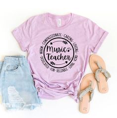 "Music Teacher T-shirt, Elementary Shirt, School Music Tee, Teacher Top, Music Lover Gift, Music Shirts, Cute Music Print Tee, Music T-shirts, Teacher Tshirt, Teacher Gift Shirt, Teacher Appreciation, Back To School, Gift For Teacher, Personalized Shirt, Custom Teacher Shirt, Music Teacher Shirt, Music Teacher Tee, Piano Teachers Shirt, Retro Music Teacher, Gift For Music Lover, Vintage Music Shirt This updated unisex essential fits like a well-loved favorite. Super soft cotton and excellent quality print makes one to fall in love with it over and over again. ------------- Fabrication ------------- 100% Combed ring spun cotton Made by specially treating the cotton fibers before spinning them into yarn. The result is stronger and smoother fabric. ------------- Unisex T-shirt Size Chart ---- Cotton Music-themed Top For Concerts, Music-themed Letter Print T-shirt For Concert, Music-themed Cotton Tops For Concerts, Music-themed Relaxed Fit Top With Screen Print, Music-themed Relaxed Fit T-shirt With Letter Print, Music-themed Letter Print Crew Neck Shirt, Music-themed Crew Neck Shirt With Letter Print, Music-themed Cotton Top, Music-themed Short Sleeve Top With Screen Print