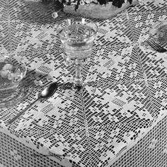 an old photo of a table set with dishes and utensils