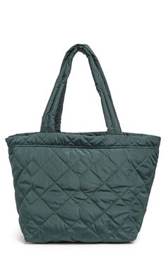 A medium sized tote bag is perfect for a "go-anywhere" style and features a quilted design. 11.5" H x 18.5" W x 8" D 10.5" strap drop Top zip closure Quilted exterior PU and terylene exterior Imported Quilted Rectangular Shoulder Bag For Everyday Use, Quilted Satchel Bag For Daily Use, Everyday Quilted Satchel Bag, Versatile Quilted Bag For Everyday Use, Quilted Double Handle Bag For Everyday, Quilted Shoulder Bag For Everyday Use, Quilted Satchel Shoulder Bag For Daily Use, Trendy Quilted Bag With Double Handle, Quilted Double Handle Shoulder Bag For Everyday