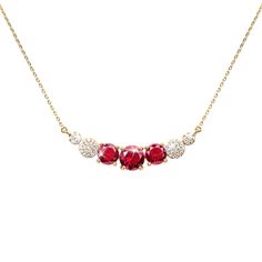 Glittering and incredibly beautiful, this stunning necklace features cherry red shimmering gems, surrounded by our signature Diamondeau®, flawless simulated diamond. Fashioned from sterling silver, gloriously finished in yellow gold. The ideal accessory for the party season. Ruby Necklace Designs, Ruby Diamond Necklace, Sapphire Eyes, Cherry Candy, Gold Watch Men, Red Necklace, Ruby Necklace, Gold Earrings Designs, Cat Pendants