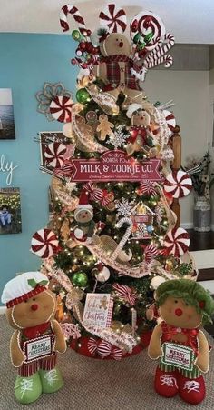 a christmas tree decorated with gingerbreads and candy canes