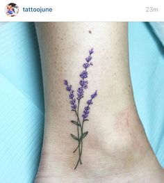 a small lavender flower tattoo on the ankle