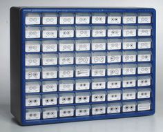 a large blue and white display case filled with lots of small plastic drawers on top of each other