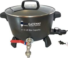 a large black pot on top of a gas burner