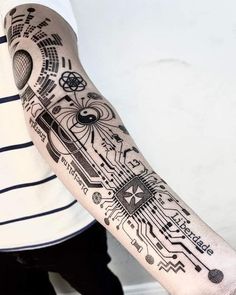 a person with a tattoo on their arm that has an image of a circuit board