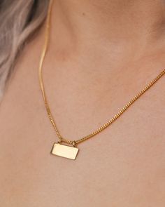 This is a gorgeous and trendy 14K gold engravable plate necklace. It is the perfect necklace to wear on its own or layered with some of your favorite pieces. This piece expertly combines classic and modern elements. The 14K yellow gold necklace features an engravable plate on an Open Curb Chain. NECKLACE DETAILS: Millimeter: 1.40 Chain Length:18 Inches Gauge: 040 Closure: Lobster Average Weight (g): 3.88 Available in: 14K yellow gold ****These necklaces have a 4-week lead time. If you need your Gold Rectangular Curb Chain Necklace, Gold Nameplate Jewelry With Box Chain, Elegant Nameplate Box Chain Jewelry, Rectangular Curb Chain Necklaces For Gift, Gold Polished Dog Tag Jewelry, Minimalist Yellow Gold Nameplate Jewelry, Rectangular Curb Chain Jewelry For Gift, Everyday Gold Nameplate Necklace, Elegant Gold Dog Tag Charm Necklace