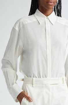 Partial yokes emphasize the dropped shoulders of this silk-enriched button-up shirt that was a featured look on the label's fall '24 runway. 29" length (size 2) Hidden-button placket Point collar Long sleeves with button cuffs 50% viscose, 42% silk, 8% elastane Dry clean Imported Designer Clothing Elegant Shirt With Concealed Placket For Spring, Elegant Spring Shirt With Concealed Placket, Designer Spring Workwear Shirt, Spring Daywear Blouse With Concealed Placket, Luxury Buttoned Shirt For Spring, Luxury Button-up Blouse With Concealed Placket, Classic Button-up Shirt With Blouson Sleeves, Designer Spread Collar Blouse For Fall, Luxury Tops With Button Closure For Spring