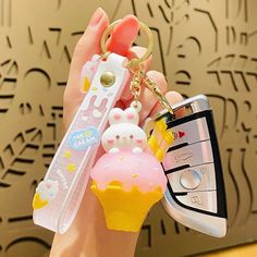 Say hello to your newest (and cutest) accessory - our Ice Cream Bunny Key Chains! These kawaii key chains are sure to bring a smile to your face every time you reach for your keys. With their sweet ice cream cone design, they're a quirky addition to any keyring. Trendy White Keychain For Gifts, White Keychain With Key Clip For Gift, White Keychain With Key Clip Gift, Kawaii White Keychain For Gift, White Kawaii Keychain For Gift, Playful Keychain Bag Charm For Gift, Playful Keychain Bag Charm As A Gift, Playful Bag Charm Keychain For Gift, Cute White Keychain For Gift