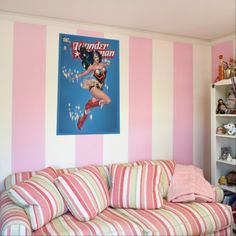 a pink and white striped living room with an ice cream sundae on the wall