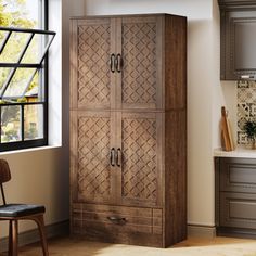 a tall wooden cabinet in a kitchen next to a window