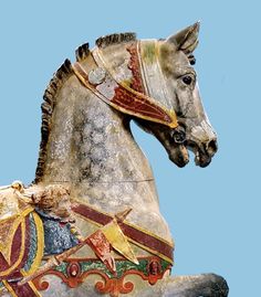 a statue of a horse is shown against a blue background