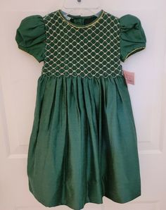 Beautiful Bettina's Designs Girls Dress SZ 2 measures  10" from armpit to armpit length  23 " beautiful  NWT check out my listing for other designer items Festive Green Dress, Festive Short Sleeve Dress-up Dress, Festive Short Sleeve Dress, Cotton Dress For Holiday Party, Green Cotton Holiday Dress, Festive Green Cotton Dress, Holiday Cotton Dress For Dress-up, Holiday Cotton Dress For Dress-up Occasions, Cotton Dress For Holiday Dress-up