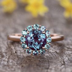 7mm round cut Alexandrite engagement ring,diamond wedding band,in solid 14k rose gold ITEM DESCRIPTION Alexandrite engagement ring ✦Solid 14k white/ rose/yellow gold ✦Approx Band width approx 1.3-1.5mm(bottom) ✦7mm round cut 1.6ctw VS Lab created Alexandrite ✦Small round cut lab created alexandrite ✦Prong Set Return and refund: We provide 30days return and exchange service. (Custom order is made by Unique demand, will be non-returnable and non-refundable). As every item in my shop is handmade to Raw Alexandrite, Vintage Diamond Wedding Bands, Morganite Jewelry, Engagement Ring Antique, Ring Cluster, Floral Engagement Ring, Alexandrite Engagement Ring, Wedding Rings Halo, Alexandrite Ring