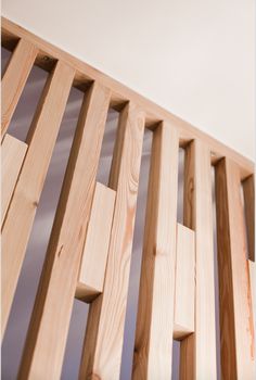 wooden slats are lined up against the wall