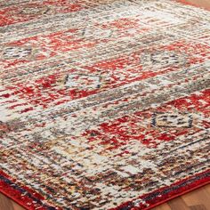 an area rug with red, white and blue colors