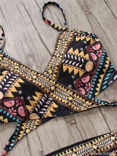 The Aztec Temptation Hollow Out Strappy Bandage Bikini is the perfect combination of fashion and style. This beautiful bikini is designed with a strappy bandage and a unique Aztec pattern. Its lightweight fabric and secure fit offer unparalleled comfort, making it an ideal choice for a fun day in the sun. modname=products&cols=5&colspace=10&rowspace=10&showName=true&showPrice=true 2018 Sexy Bandage Aztec Biquini String Strappy Swim Wear Bathing Suit Swimsuit Beachwear Swimwear Women Brazilian Bi Beachwear Swimwear With Wrap-around Straps, Summer Swimwear With Wrap-around Straps For Vacation, Vacation Swimwear With Crisscross Straps And Triangle Top, Strappy Beachwear Swimwear With Wrap-around Straps, Beach Swimwear With Wrap-around Straps And Tie-side Bottom, Strappy Wrap-around Swimwear For Beachwear, Multicolor Strappy Swimwear For Pool, Multicolor Strapped Swimwear For Pool, Beach Swimwear With Crisscross Straps Triangle Top