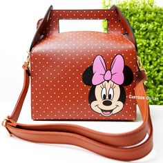 Add A Touch Of Disney Magic To Your Wardrobe With This Minnie Mouse Purse! Measures About 8" Wide And 9.5" Tall (Not Measuring The Straps) 4" Deep. The Box Shape And Faux Leather Material Make It A Stylish And Durable Choice. Perfect For Fans Of The Iconic Character, Can Hold All Your Daily Essentials. Whether You're Headed To The D23 Expo Or Just Running Errands, This Purse Is A Must-Have Accessory. This Disney Minnie Mouse Purse Is Brand New And Unmodified, Making It A Great Gift For Any Colle Disney Style Gift Bag, Rectangular Shape, Trendy Rectangular Bags For Disney Trips, Cute Rectangular Minnie Mouse Bags, Minnie Mouse Purse, Disney Bag, Leather Box, Girly Accessories, Purse Bag, Iconic Characters