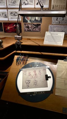 a desk that has some drawings on it