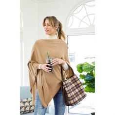 A fan favorite, this flattering lightweight poncho with elegant draping. Material(s):Acrylic. Versatile Fall Poncho, Casual Solid Color Poncho For Fall, Casual Cape For Fall Workwear, Casual Fall Cape For Workwear, Casual Workwear Cape For Fall, Casual Fall Workwear Cape, Casual Cape Poncho For Layering, Casual Layering Cape Poncho, Casual Layering Poncho Cape